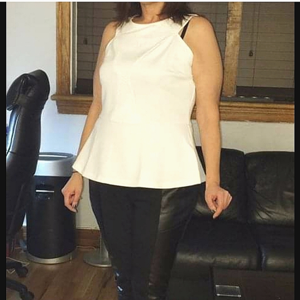 White peplum sleeveless top